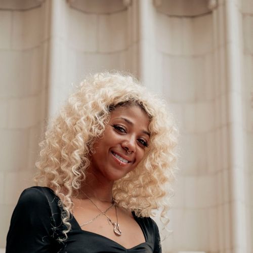 Portrait of Katarzyna, a happy and confident woman.